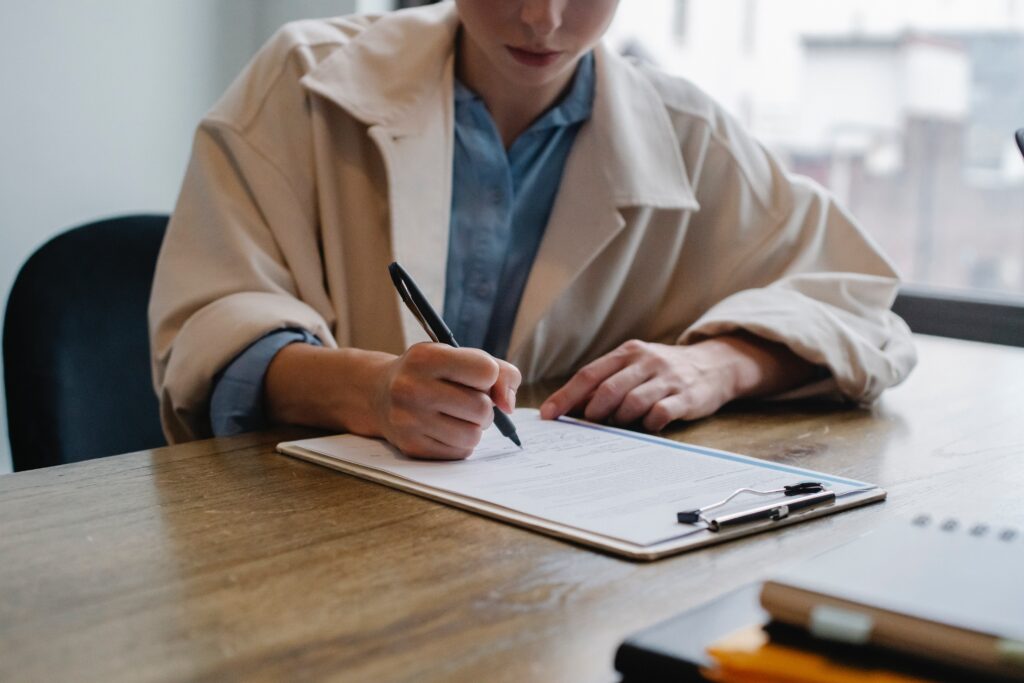 Woman signs contract