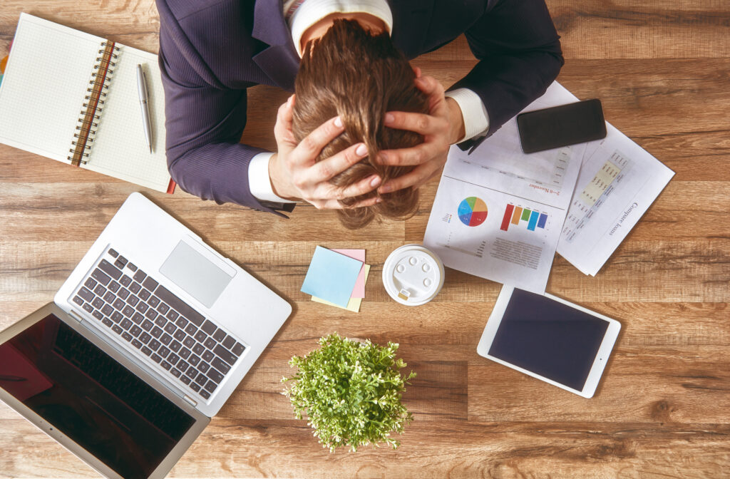 businessman,in,panic. a,young,man,sits,at,his,desk